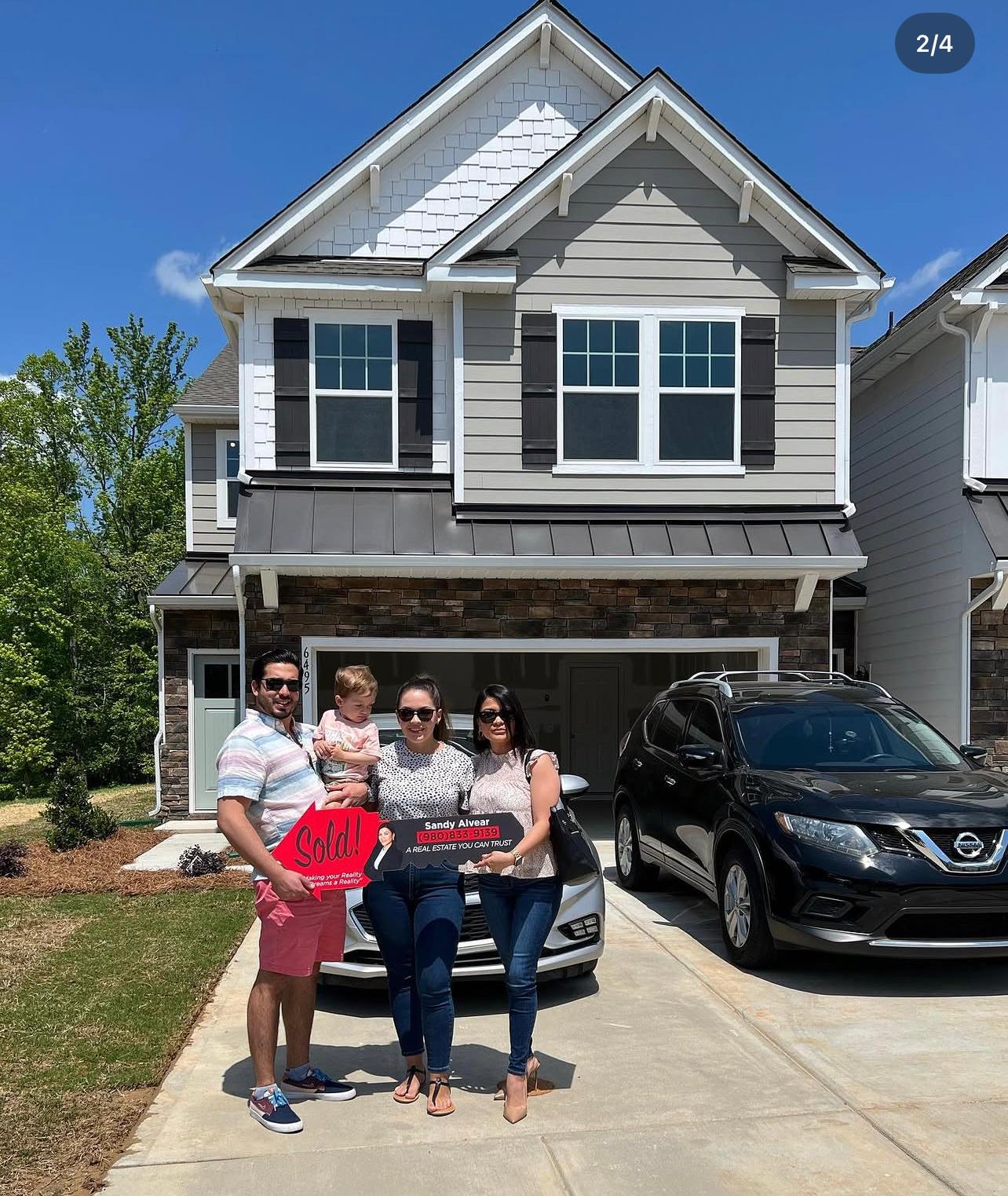 Family with Sandy Alvear at sold new construction home
